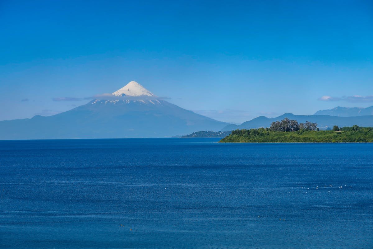 Osorno Volcano rising above Lake Llanquihue under clear blue skies in Chile Lake District
