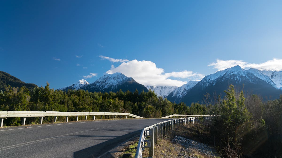 Winding road through green valleys along Chile's Carretera Austral