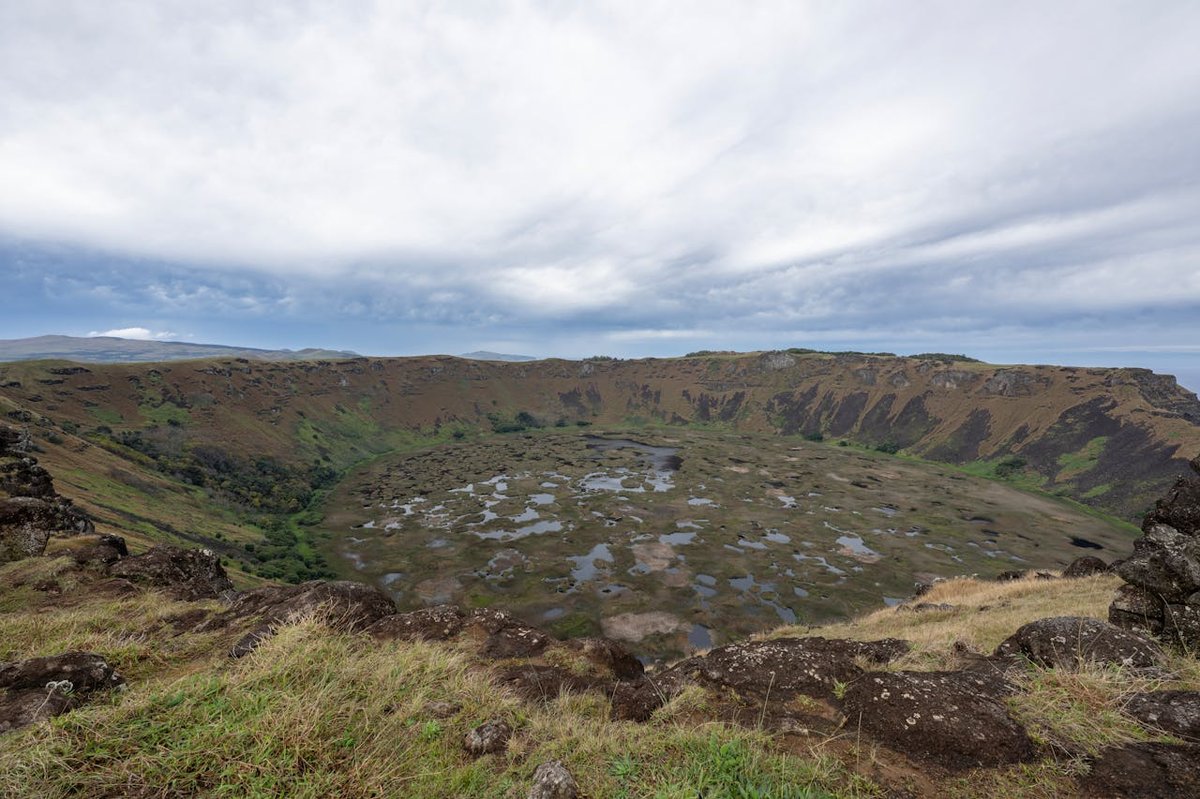 Volcanic crater of Rano Kau on Easter Island filled with a reed-covered lake and dramatic cliffs