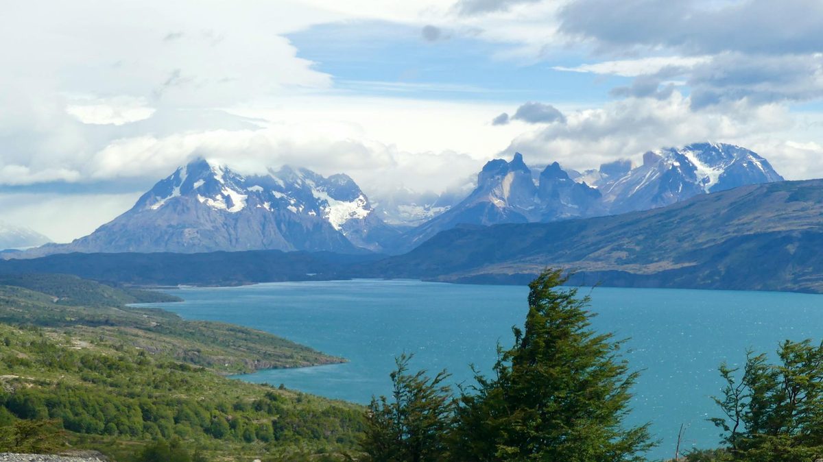 Dramatic mountain landscape of Torres del Paine National Park reflected in a turquoise lake