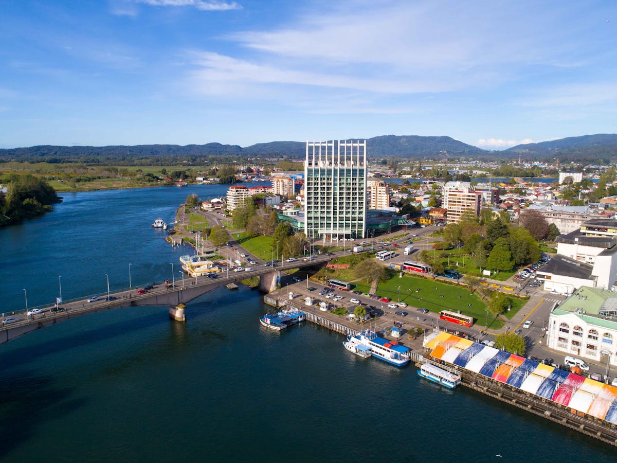 Aerial view of Valdivia, Chile, showing the river, bridge, and city architecture