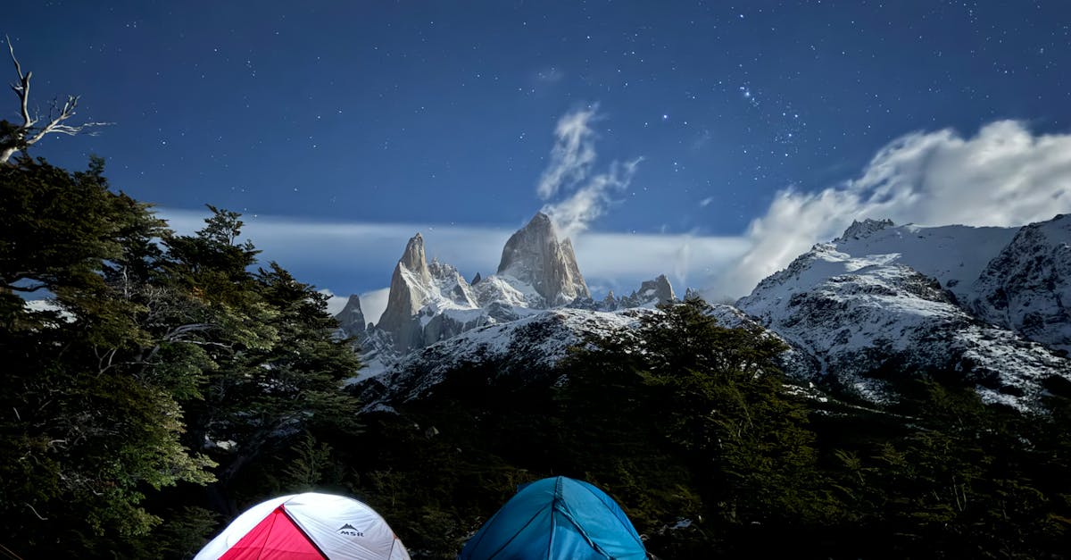 Camping tents at night with Mt. Fitz Roy and starry sky in Patagonia