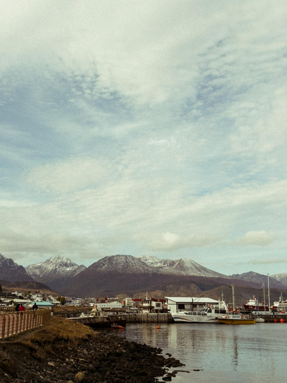 Marina and harbor with mountains behind in the Tierra del Fuego region of southern South America