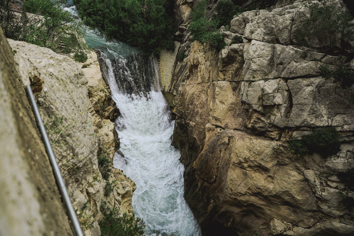 Dramatic mountain canyon with river flowing through rocky landscape