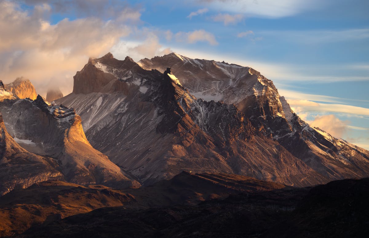 Sunrise over the rugged peaks of Torres del Paine with dramatic light